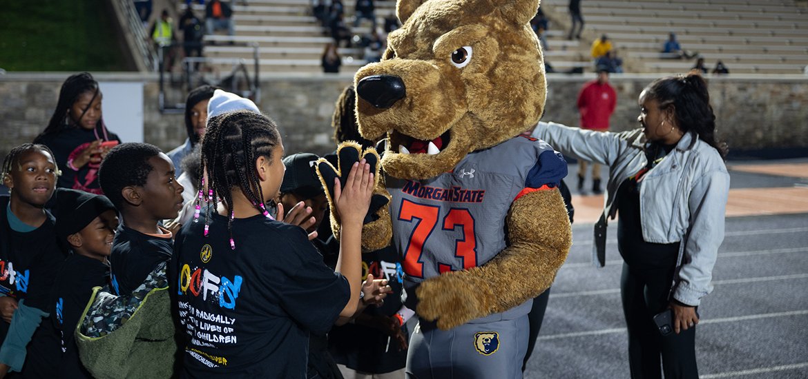 Morgan State mascot with group of children during MOCFS Family Night MSU